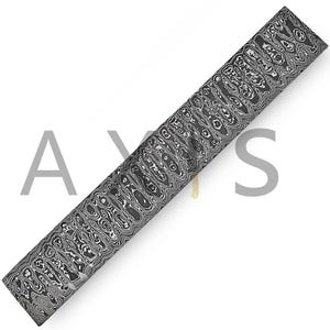 May include: A long, rectangular blade with a distinctive, swirling pattern in shades of gray and black. The blade has a small, gold-colored attachment near the end. The word "AXS" is faintly visible in the background.