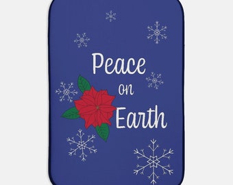 Christmas poinsettia and snowflake design "Peace on Earth" dish mat