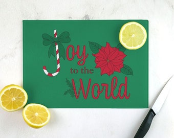 Christmas Holly, Candy Cane and Poinsettia design "Joy to the World" tempered glass cutting board