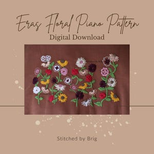 May include: A digital download pattern for a floral embroidery design. The design features a variety of flowers in shades of yellow, pink, red, and brown, stitched on a brown fabric. The text "Stitched by Brig" appears at the bottom of the image.