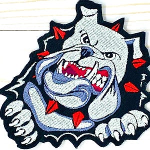 May include: Embroidered iron-on patch featuring a white bulldog with red teeth and claws, breaking through a black background with red spikes.
