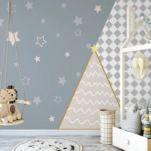 May include: A light blue nursery wall mural with a white geometric pattern and a pink triangle with white wavy lines. The mural features a variety of white stars and a white swing with two plush toys.