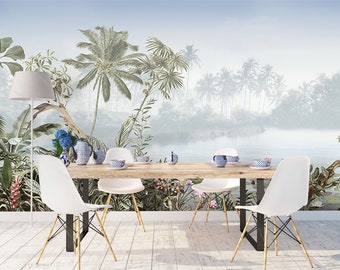 May include: A dining room with a tropical mural featuring palm trees, lush foliage, and a lake. The mural is painted in shades of green, blue, and white. Four white chairs surround a wooden table.