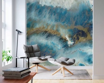 May include: Abstract wall art featuring a blue, white, and gold color scheme. The artwork depicts a swirling, fluid design reminiscent of water or clouds.