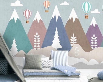 May include: A nursery wall mural featuring a whimsical mountain landscape with colorful hot air balloons. The mountains are in shades of blue, purple, brown, and pink. The balloons are white with blue and red stripes.