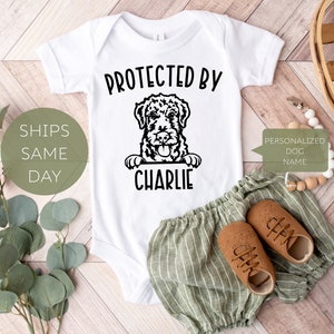 Protected by Dog Onesie®, Personalized Dog Baby Onesie®, Cute Pet Baby Bodysuit or T-Shirt, Dog Name Baby Onesie®, Pet Dog Baby Announcement