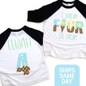 May include: Two white and black baseball shirts with ice cream cone designs. One shirt says "I scream for ice cream" with the number four made of ice cream cones. The other shirt says "Elijah" with the number four made of ice cream cones.