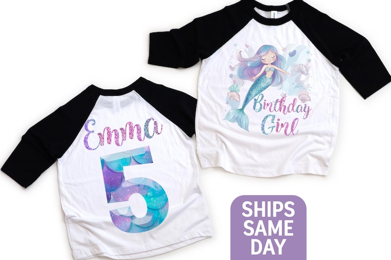 May include: White and black raglan-style birthday shirts. One shirt features a mermaid illustration with the text "Birthday Girl". The other shirt has the name "Emma" and the number "5" in a mermaid scale design.