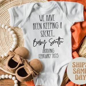 Baby Announcement Onesie®, Personalized Custom Baby Announcement Onesie®, We Have Been Keeping a Secret Name and Date Baby Reveal Onesie®