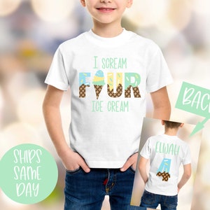 May include: White t-shirt with the text "I scream four ice cream" in colorful letters shaped like ice cream cones. The back of the shirt has the name "Elijah" with an ice cream cone shaped letter A.