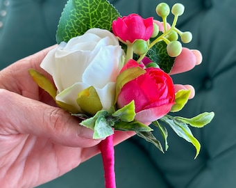 White and pink boutonnière