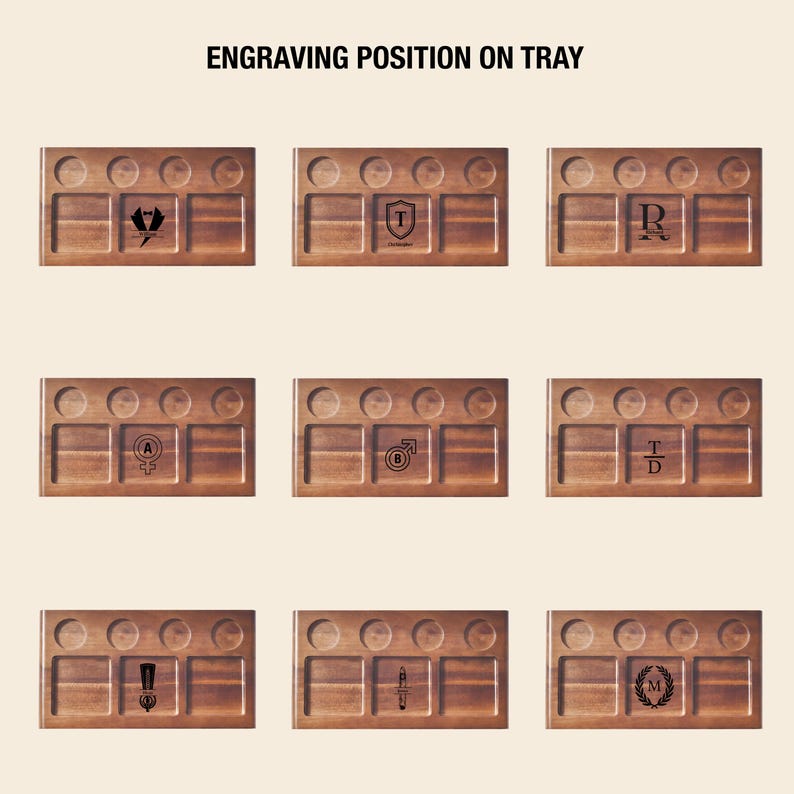 a collection of nine wooden tray designs, each with a unique engraved pattern or symbol. The trays are arranged in a grid format, showcasing various shapes, symbols, and text. The image does not contain any text, and the arrangement of the trays is consistent and orderly.