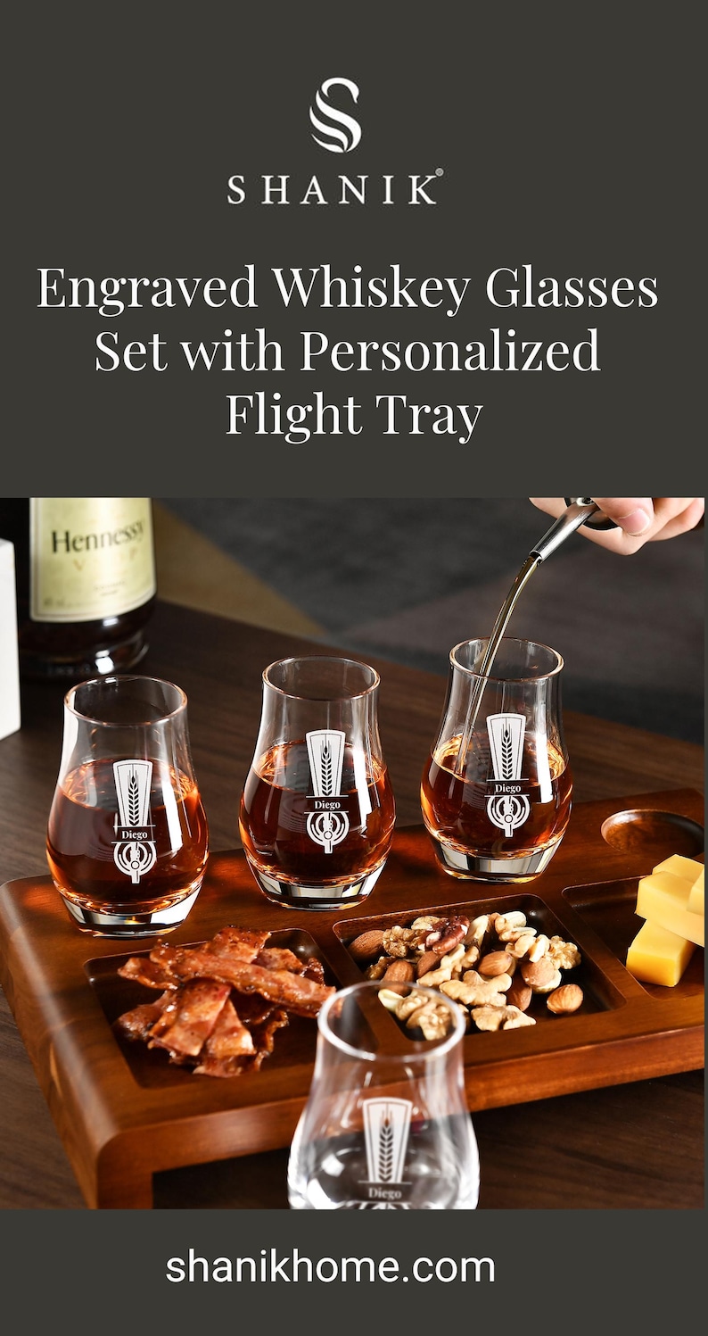 a set of engraved whiskey glasses set with personalized flight trays, accompanied by a bottle of Hennessy whiskey.