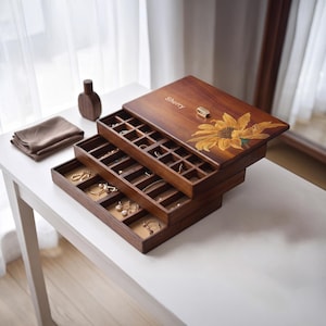 May include: A multi-tiered wooden jewelry box with a dark brown finish, featuring a sunflower illustration and the name Sherry engraved on the lid. The box has three sliding trays with multiple square compartments for organizing small accessories.