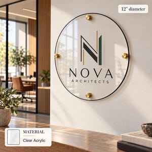a round sign with the word "NOVA" and "ARCHITECTS" written on it, mounted on a wall.