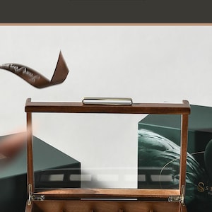 The image is an advertisement for a perfect Christmas gift for a boyfriend. It features a wooden box with multiple compartments, designed to hold and organize various items. The box is placed on a white background, and there is a text overlay that reads "SHANKI" and "Perfect Christmas Gift for Boyfriend".
