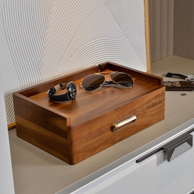 a pair of sunglasses sitting on top of a wooden box