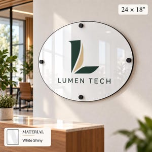 a round sign with the text "LUMEN TECH" displayed on it, mounted on a wall.
