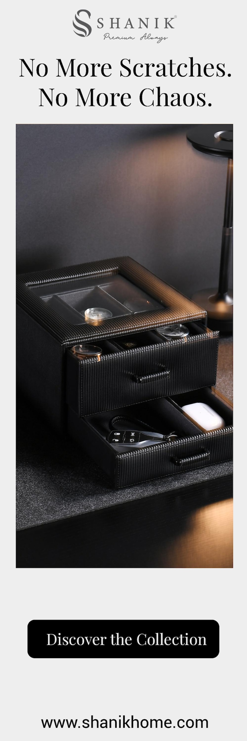 a black drawer organizer with a drawer and a compartment, sitting on a desk.