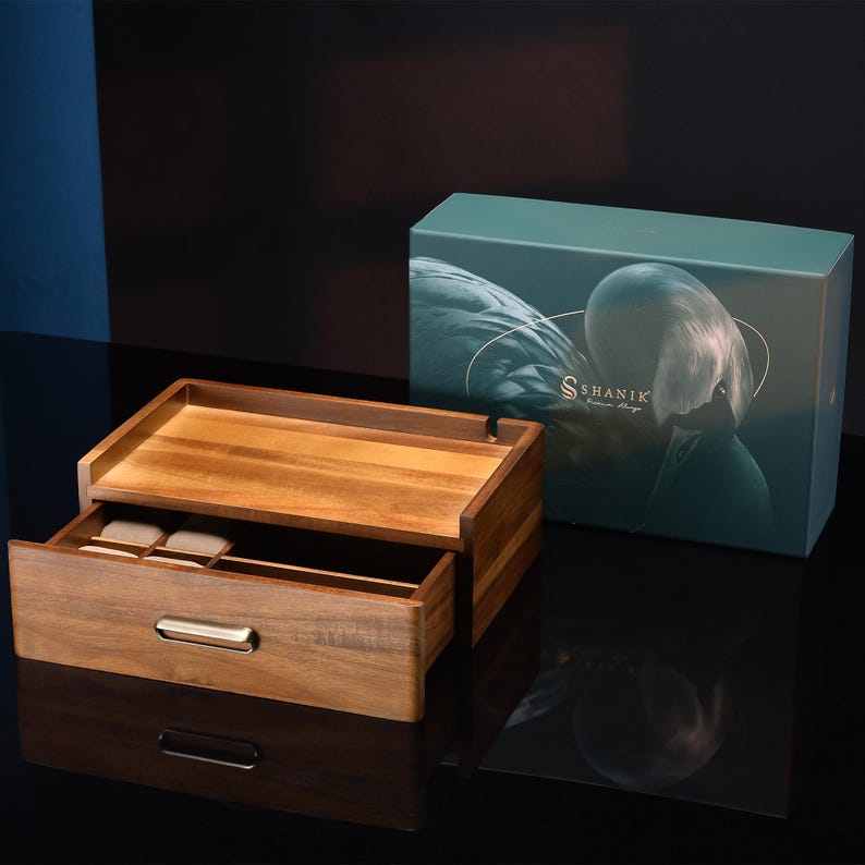 a wooden box with a watch inside of it
