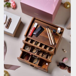 a pink box that has some items inside of it