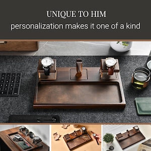 The image showcases a wooden watch stand with three watch faces on it, accompanied by a keyboard, a cup, and a plant. The text above the image reads "UNIQUE TO HIM personalization makes it one of a kind".