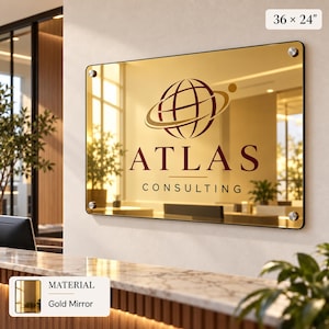 a large glass mirror with the logo of Atlas Consulting displayed on it.