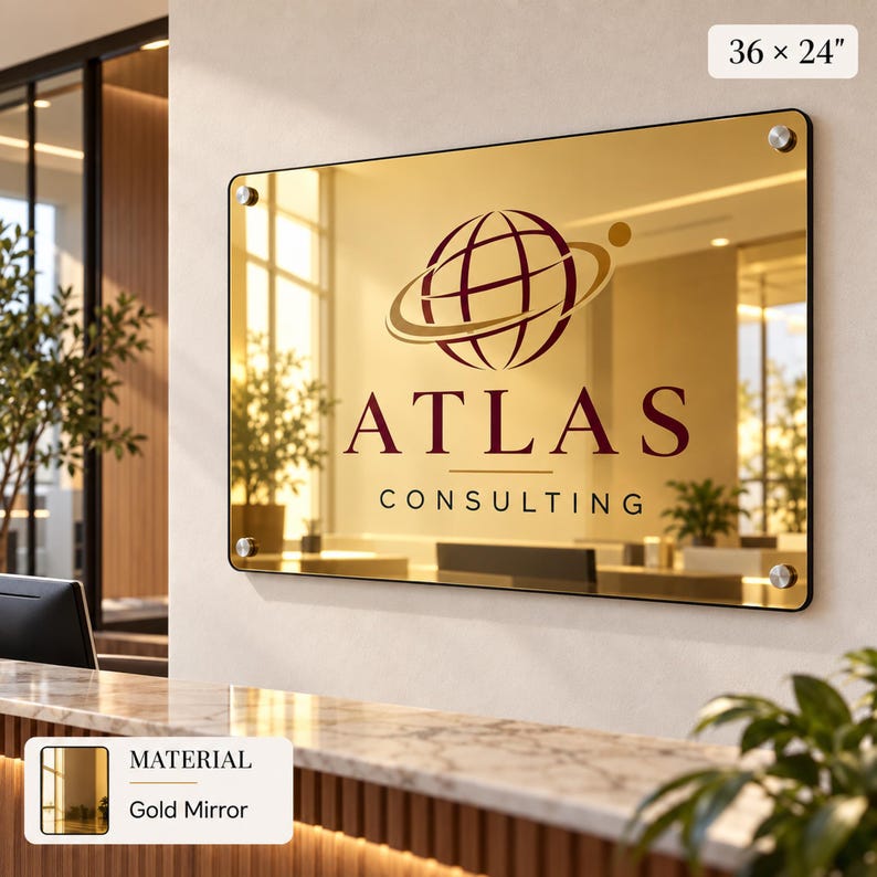 a large glass mirror with the logo of Atlas Consulting displayed on it.