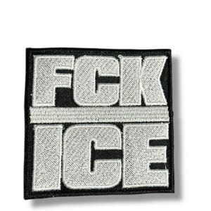 May include: Square embroidered patch with the text "FCK ICE" in white, block letters. The text is divided by a horizontal line. The patch has a black border and is set against a white background.