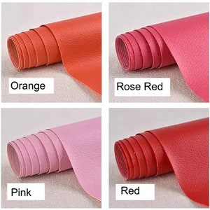 K&ouml;nnte beinhalten: Vier Rollen Kunstleder in verschiedenen Farben: Orange, Rosarot, Pink und Rot. Die Rollen sind alle gleich gro&szlig; und in einem Raster angeordnet.