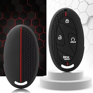 Peut inclure: Housse de clé de voiture en silicone noir avec une bande rouge. La housse présente un motif en nid d'abeille texturé et des symboles de clé pour verrouiller, déverrouiller et démarrer à distance. La housse de clé est de forme ovale.