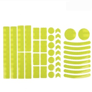 May include: A sheet of yellow reflective stickers for bicycles. The stickers include various shapes, such as rectangles, circles, and arrows.