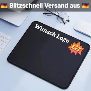 May include: Black rectangular mousepad with the text "Wunsch Logo" in white. A graphic that says "LIT" in orange and purple is in the lower right corner. The mousepad is on a light blue surface with a keyboard, glasses, and a mouse visible.