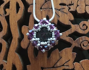 A Handmade Swarovski Pendant "Karratu" designer Jean Power. 40% of the price will go to www.bread-trust.org.uk for their work in Tanzania