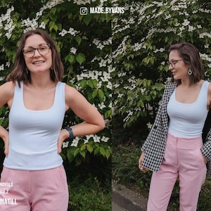 May include: A woman wearing a light blue tank top and pink pants, with a black and white houndstooth blazer. The image includes the text "ROUND NECK / RUNDHALS LENGTH 2 / LARGE 2 #SEWINGMACHINATILL".