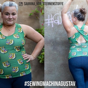 May include: Green tank top with a repeating tiger face pattern. The tank top has a criss-cross back design. The text "#SEWINGMACHINAGUSTAV" is at the bottom of the image. The Instagram handle "SABRINA_VON_STERNENSTOFFE" is at the top.