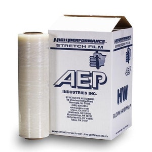 May include: A white box with blue text that reads "High Performance Stretch Film" and "AEP Industries Inc." The box contains a roll of clear plastic stretch wrap. The text on the box also includes the company's contact information and the statement "Manufactured at an ISO 9001: 2008 Certified Facility."