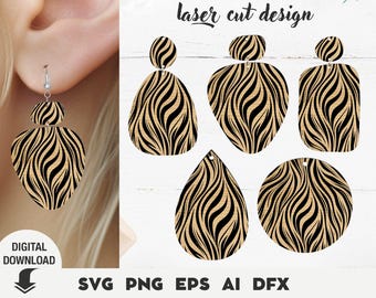 May include: A pair of earrings with a zebra stripe pattern is shown on a person's ear. The earrings are made of wood and have a black and tan design. The image also shows several other earring designs with the same pattern. The text "laser cut design" is at the top.