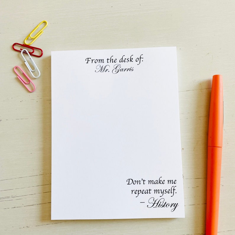 May include: White notepad with the text "From the desk of: Mr. Garris" at the top and "Don't make me repeat myself. - History" at the bottom.