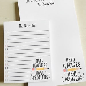 May include: A white notepad with black lines and the text "Ms. Natividad" at the top. The bottom of the notepad has a pencil drawing with the text "MATH TEACHERS HAVE PROBLEMS =" in black text.