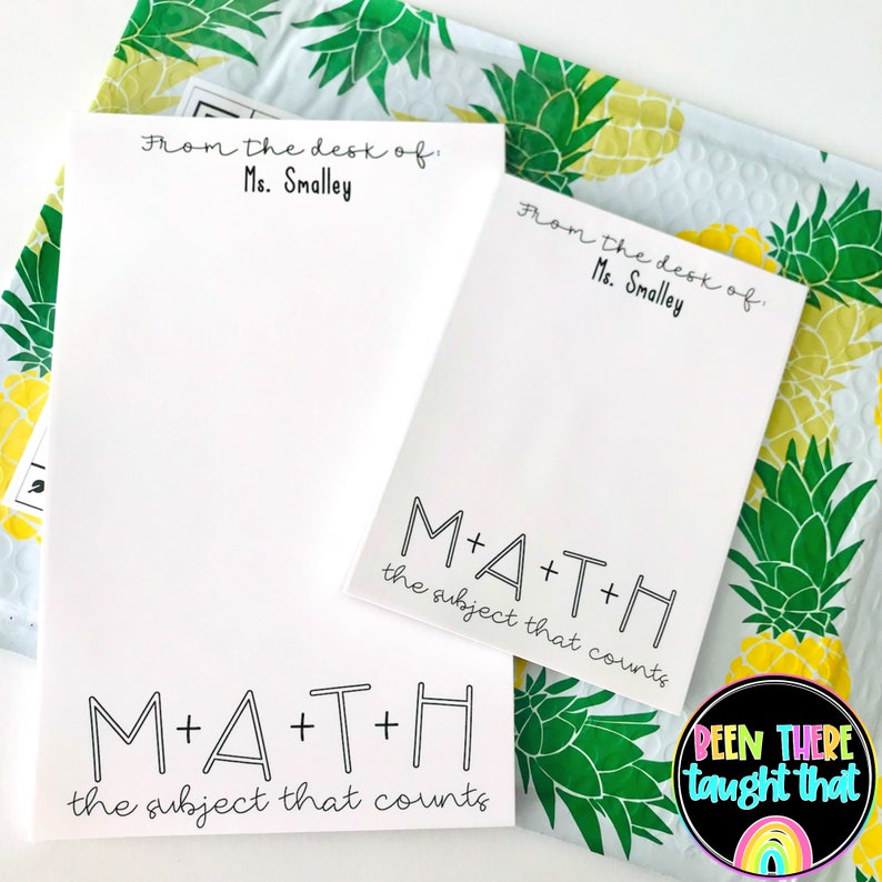 May include: Two white notepads with black text. The top notepad says "From the desk of Ms. Smalley" and the bottom notepad says "M+A+T+H the subject that counts". The notepads are on a background of a yellow and green pineapple pattern.