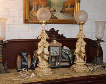 A Pair of Vintage Ceramic Cherub Electric Lamps