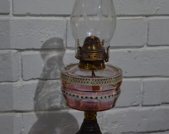 An Art Nouveau Cast Iron and Glass Oil Lamp