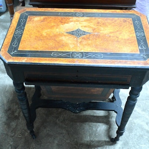 An Unusual and Rare Maple Birds eye and Ebonised Writing Table