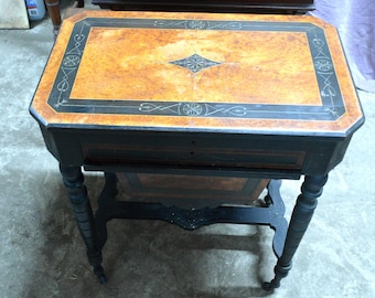 An Unusual and Rare Maple Birds eye and Ebonised Writing Table