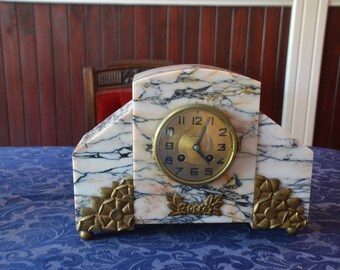 An Art Deco Marble and Bronze Clock