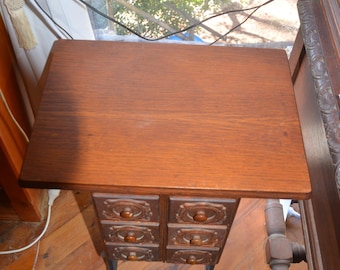 A Singer 6 Drawer Side Table