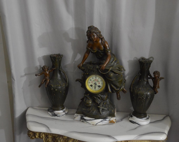 Featured listing image: An L & F Moreau "Mignon" Bronze and Marble Clock and Garniture Set