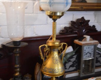 An Antique French Brass and Blue Enamel Electric Altar Lamp