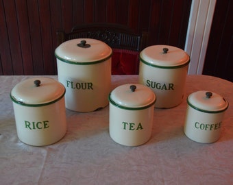 A Set of 1930's Metters Cream and Green Enamel Canisters
